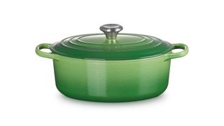 Le Creuset casserole dish in bamboo green on white background