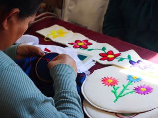 A woman doing hand-embroidery.