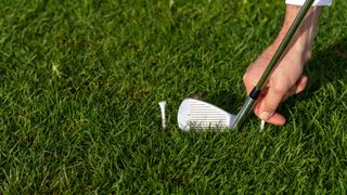 PGA pro Dan Hendriksen setting up a drill to help golfers strike the ball better