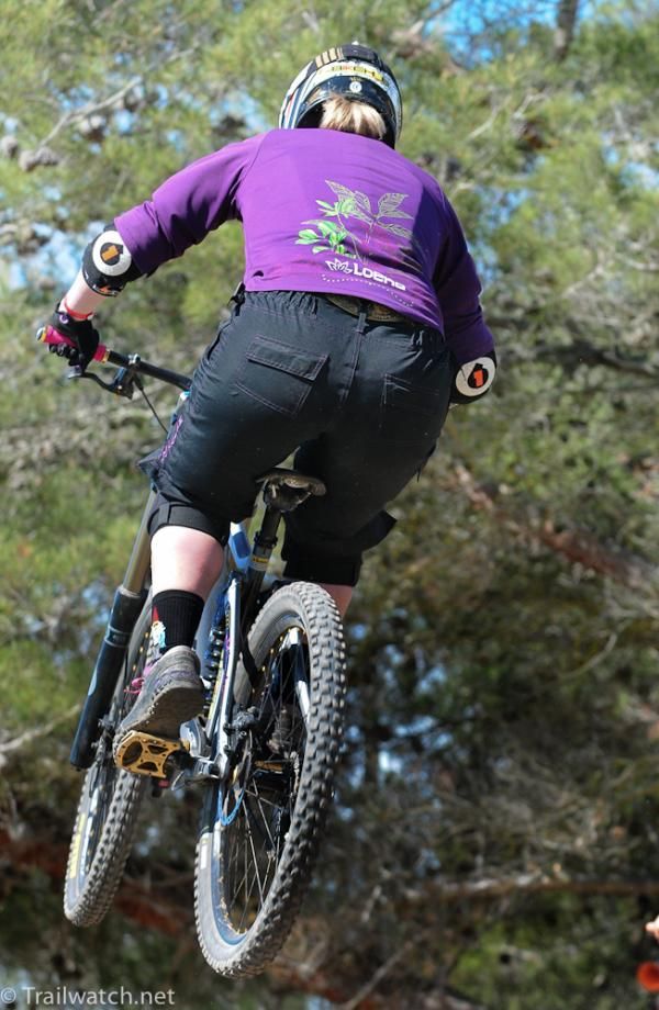 Jaime Rees in the air on the top of the course