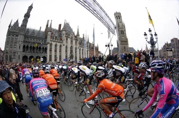 The riders leave the start in Brugge