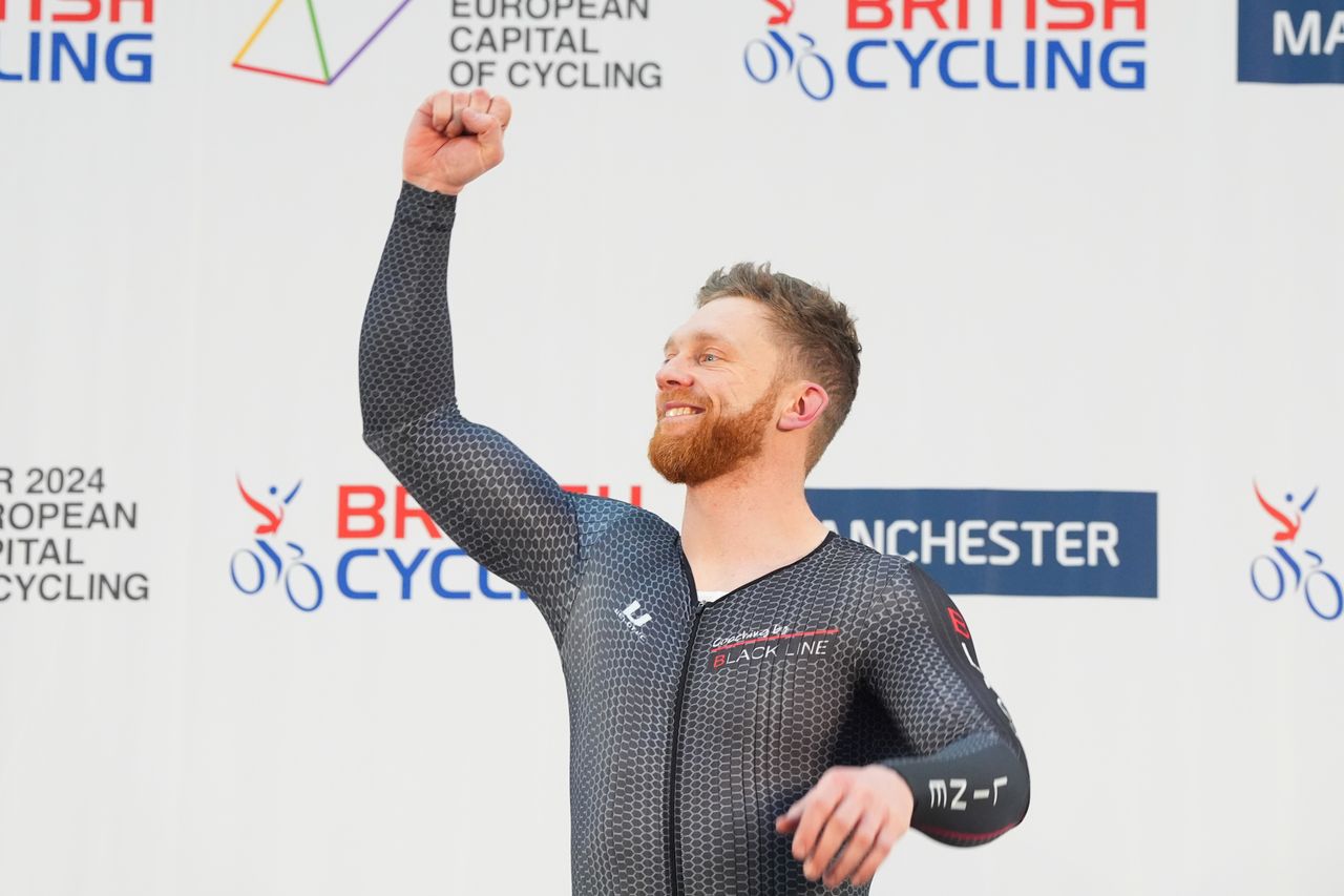 Peter Mitchell celebrates in a black jersey