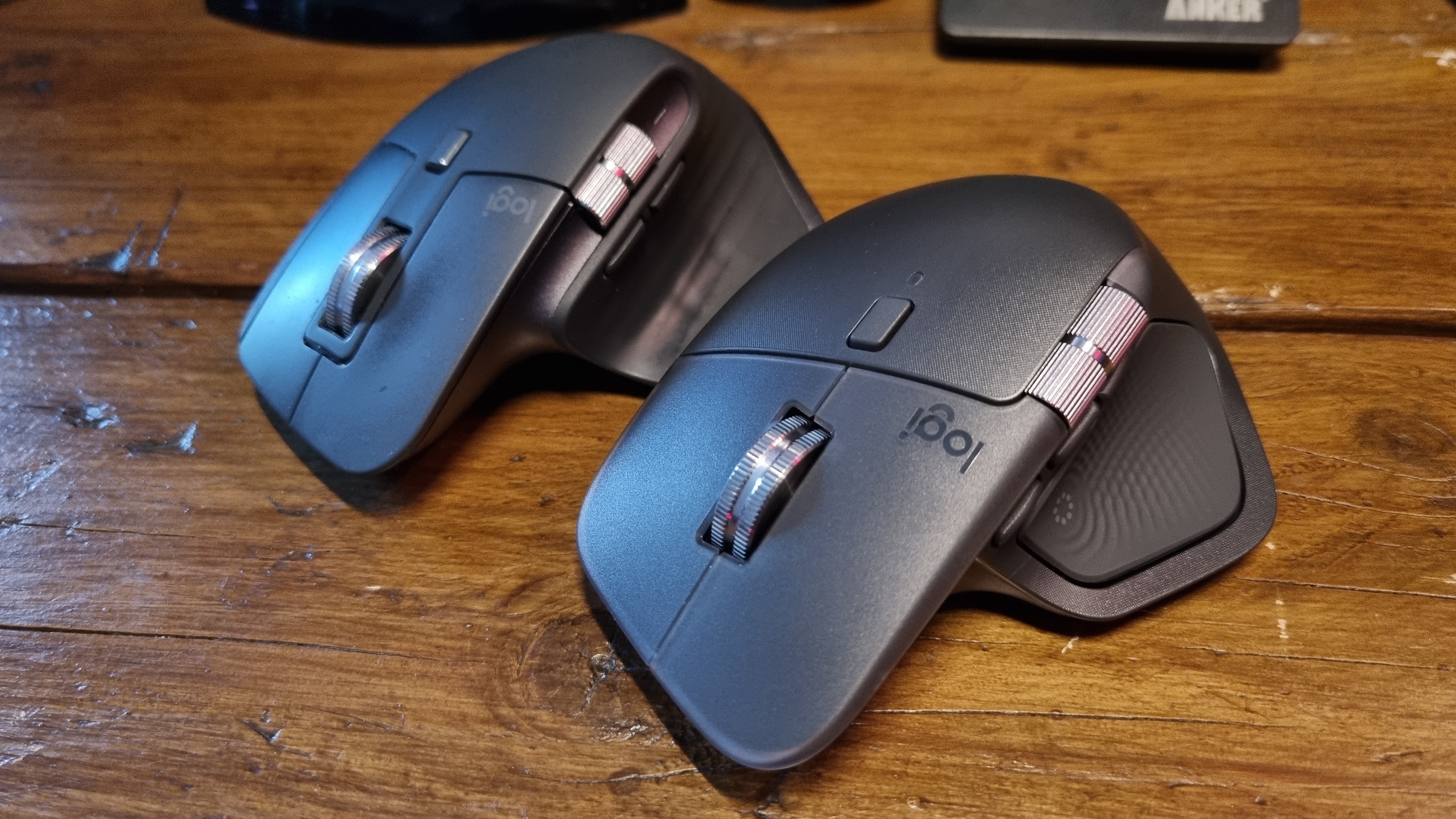 The Logitech MX Master 4 sitting in front of the Logitech MX Master 3S