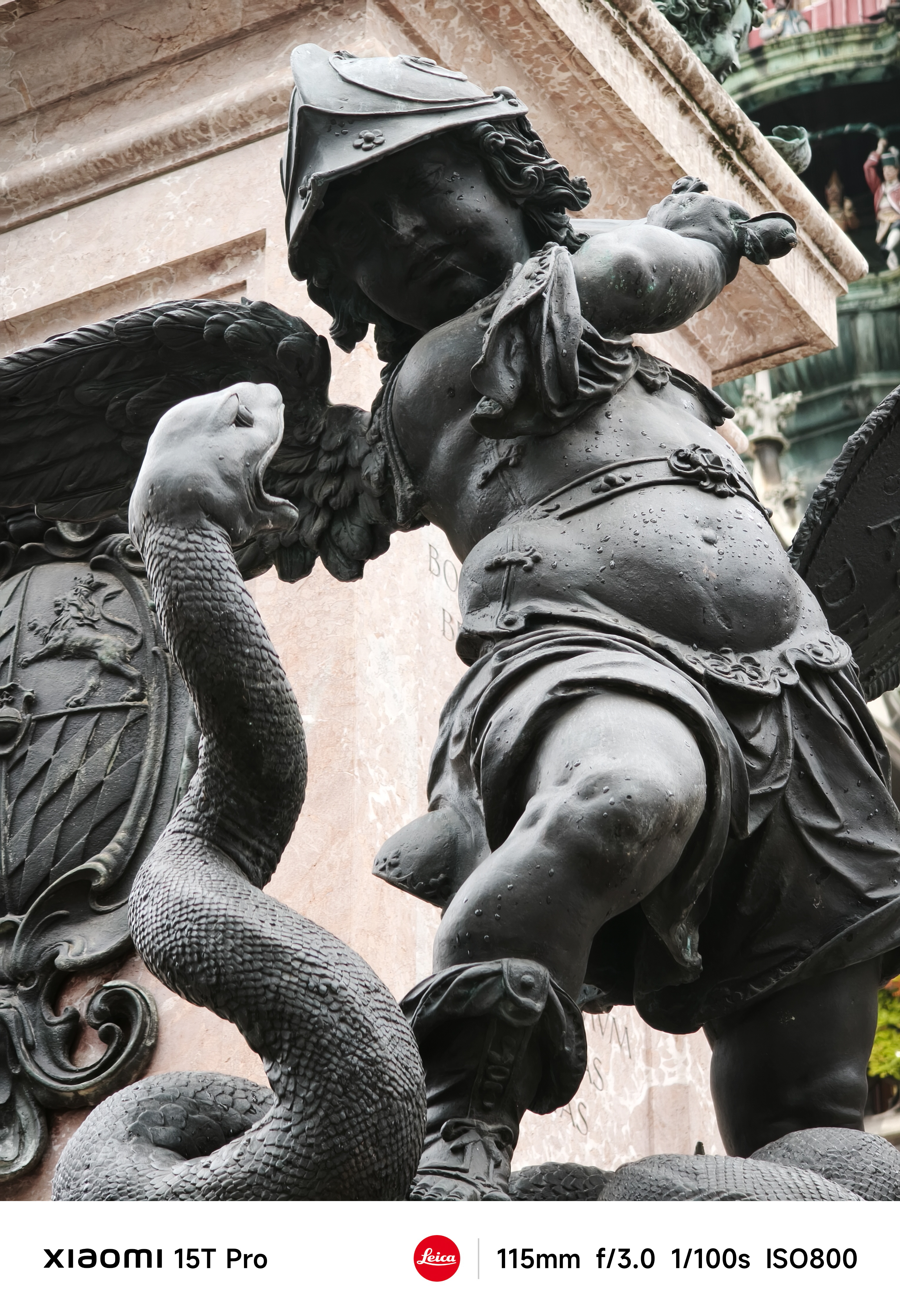 Statue of a cherub fighting a snake