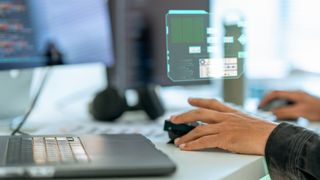 person using an AI PC to code