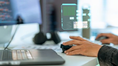 person using an AI PC to code