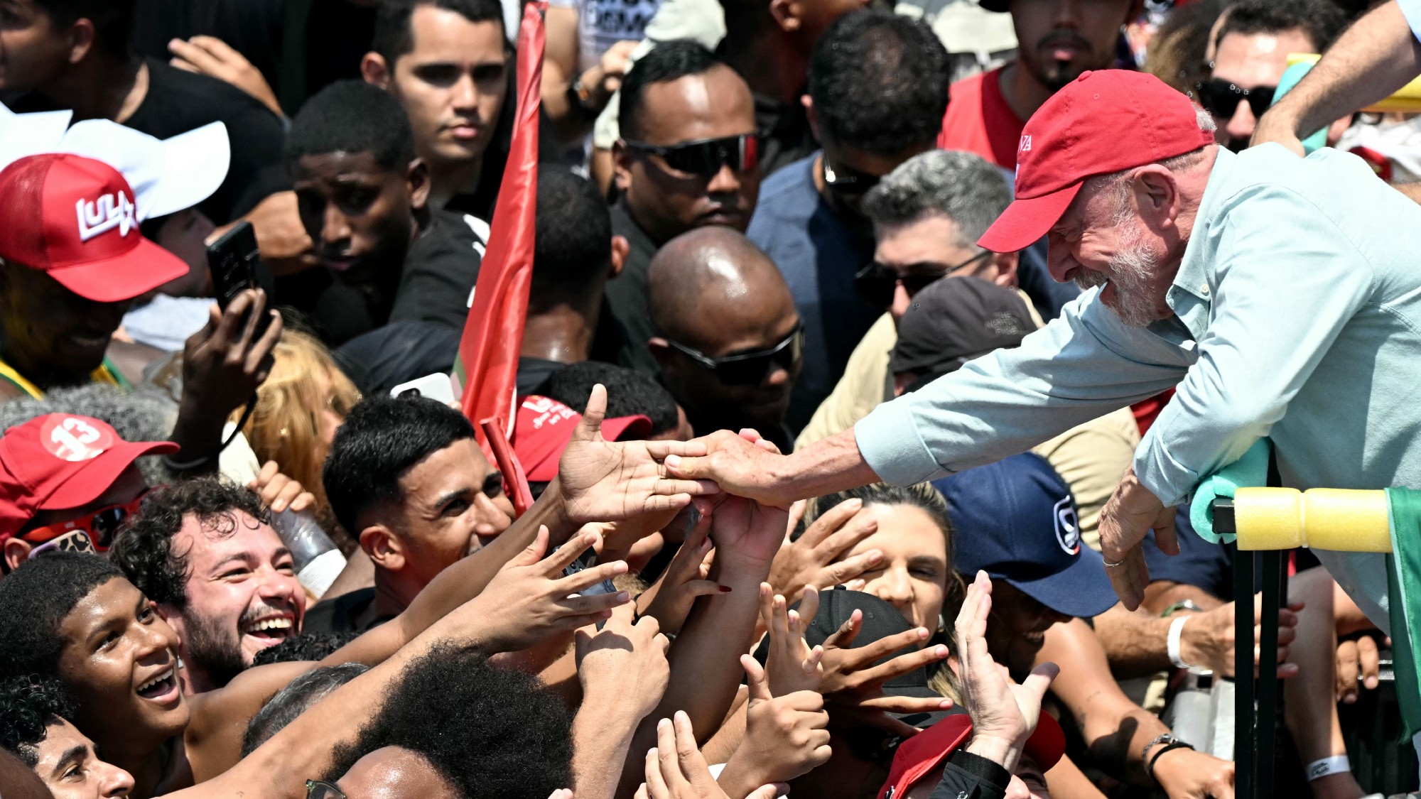 Luiz Inacio Lula da Silva greets supporters during a rally on Copacabana beach in Rio de Janeiro
