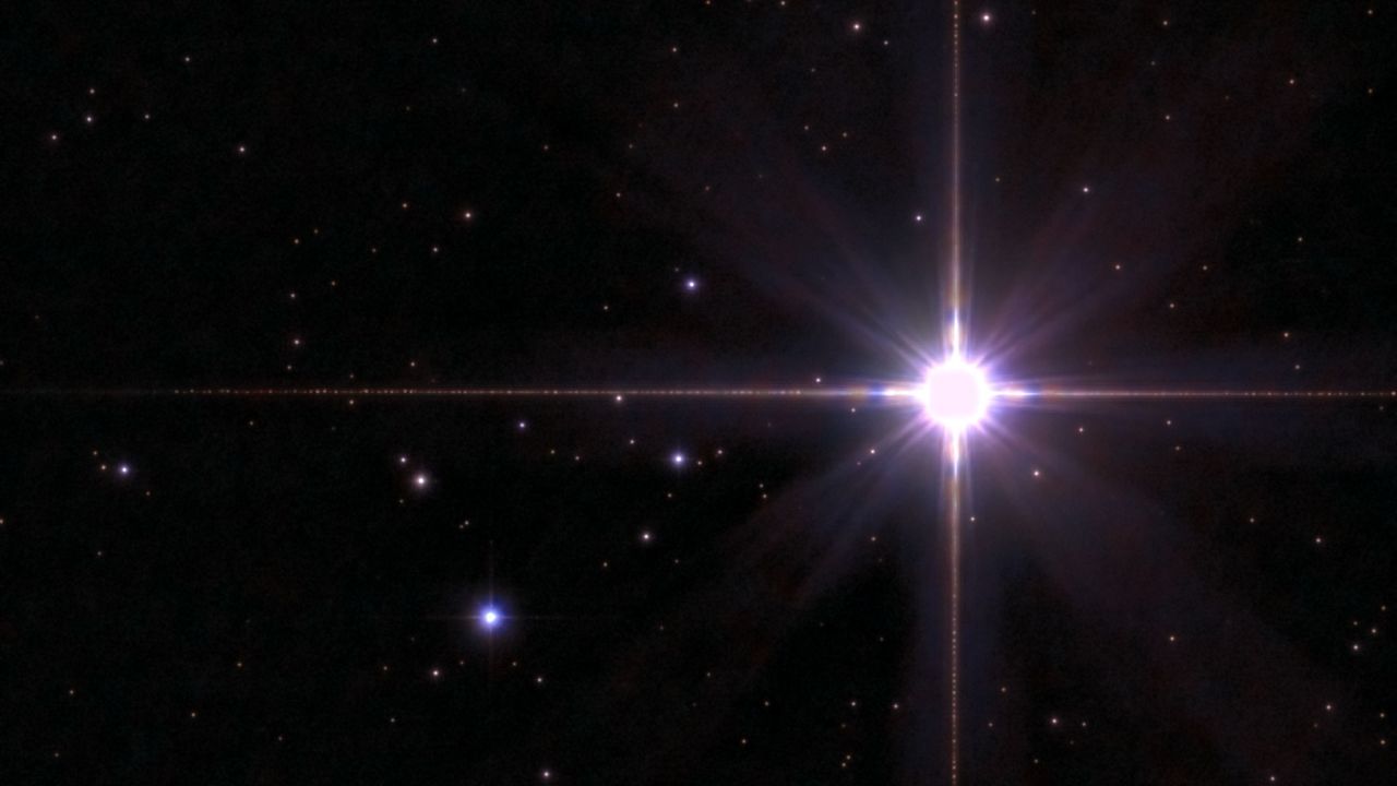 The star Arcturus shining in the starry night sky.