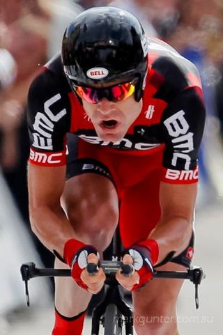 Cadel Evans powers to victory in the Grenoble time trial at the Tour de France.