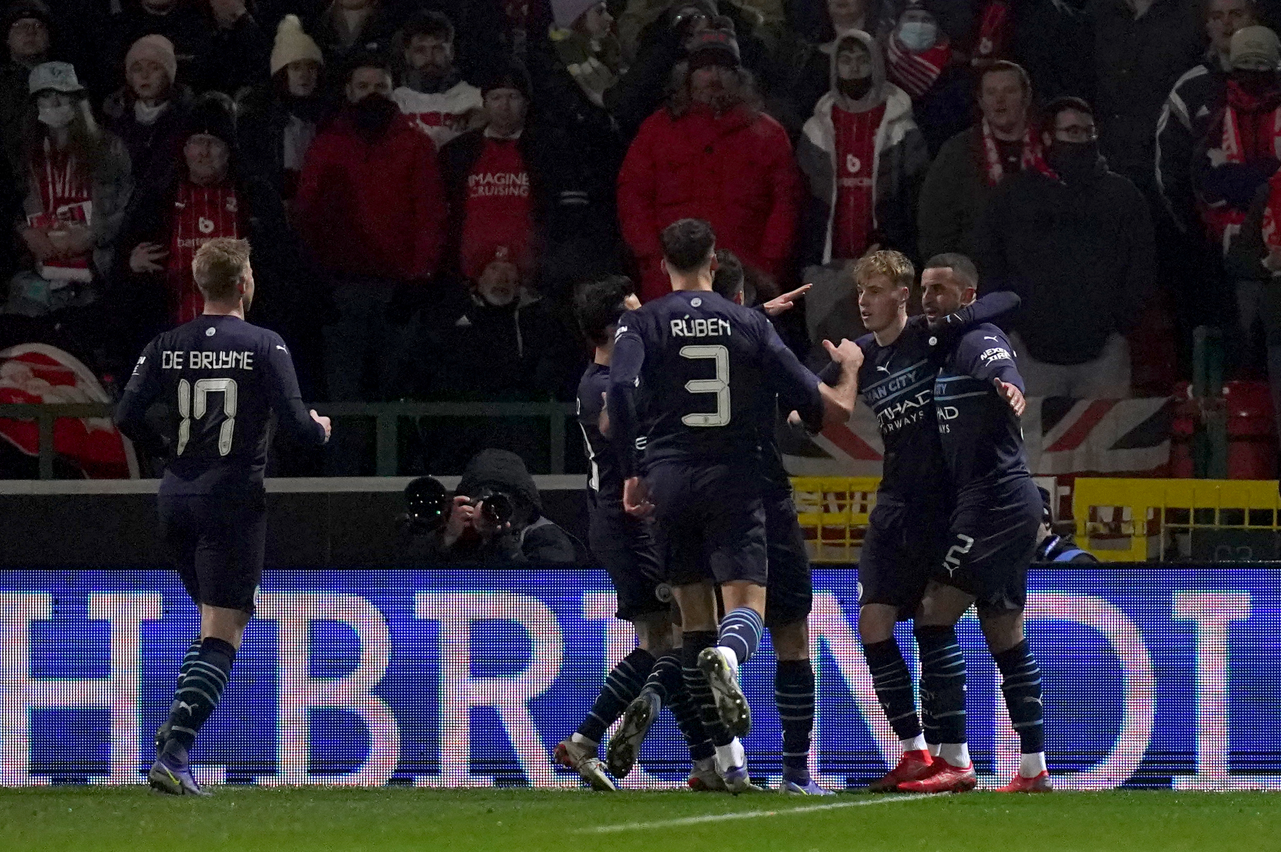 Manchester City players celebrate their side’s first goal