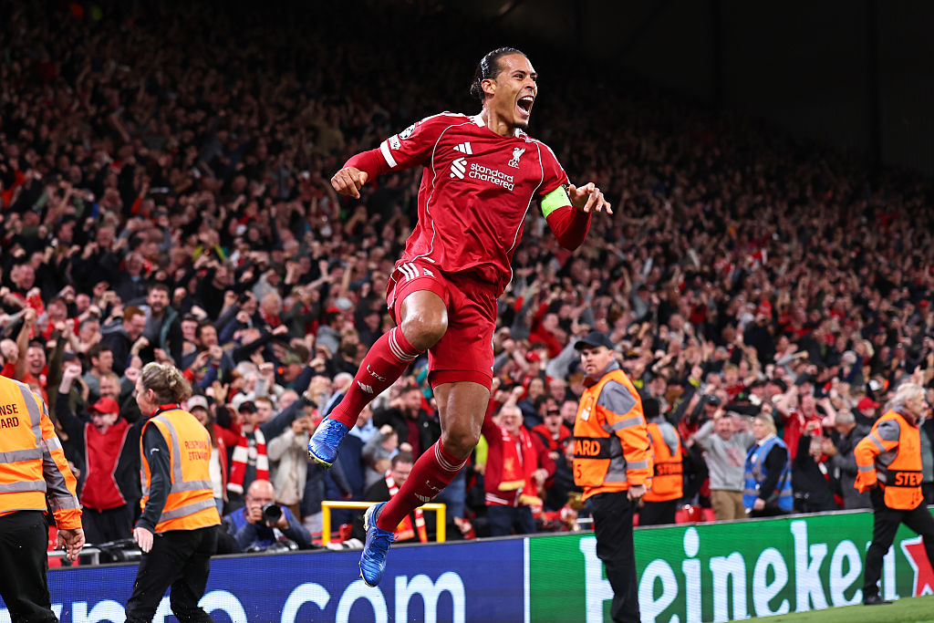 Virgil van Dijk of Liverpool celebrates after scoring a goal to make it 3-2 during the UEFA Champions League 2025/26 League Phase MD1 match between Liverpool FC and Atletico de Madrid at Anfield on September 17, 2025 in Liverpool, England.
