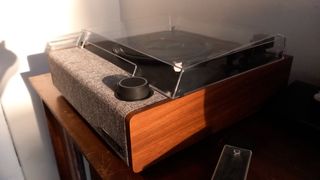 The Victrola Eastwood II turntable on a wooden surface