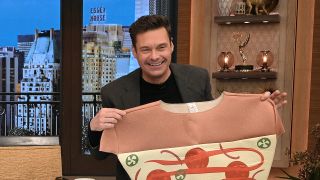 Ryan Seacrest smiles with a pizza costume on Live with Kelly and Ryan.