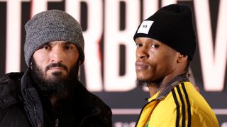 Professional boxers Artur Beterbiev of Russia (left, in grey woolly hat) and Anthony Yarde of Great Britain (right, in yellow tracksuit) face off ahead of their light heavyweight fight on Saturday, January 28 2023. 