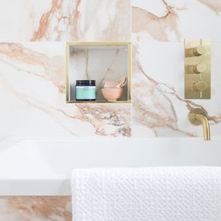 marble effect bathroom with alcove storage
