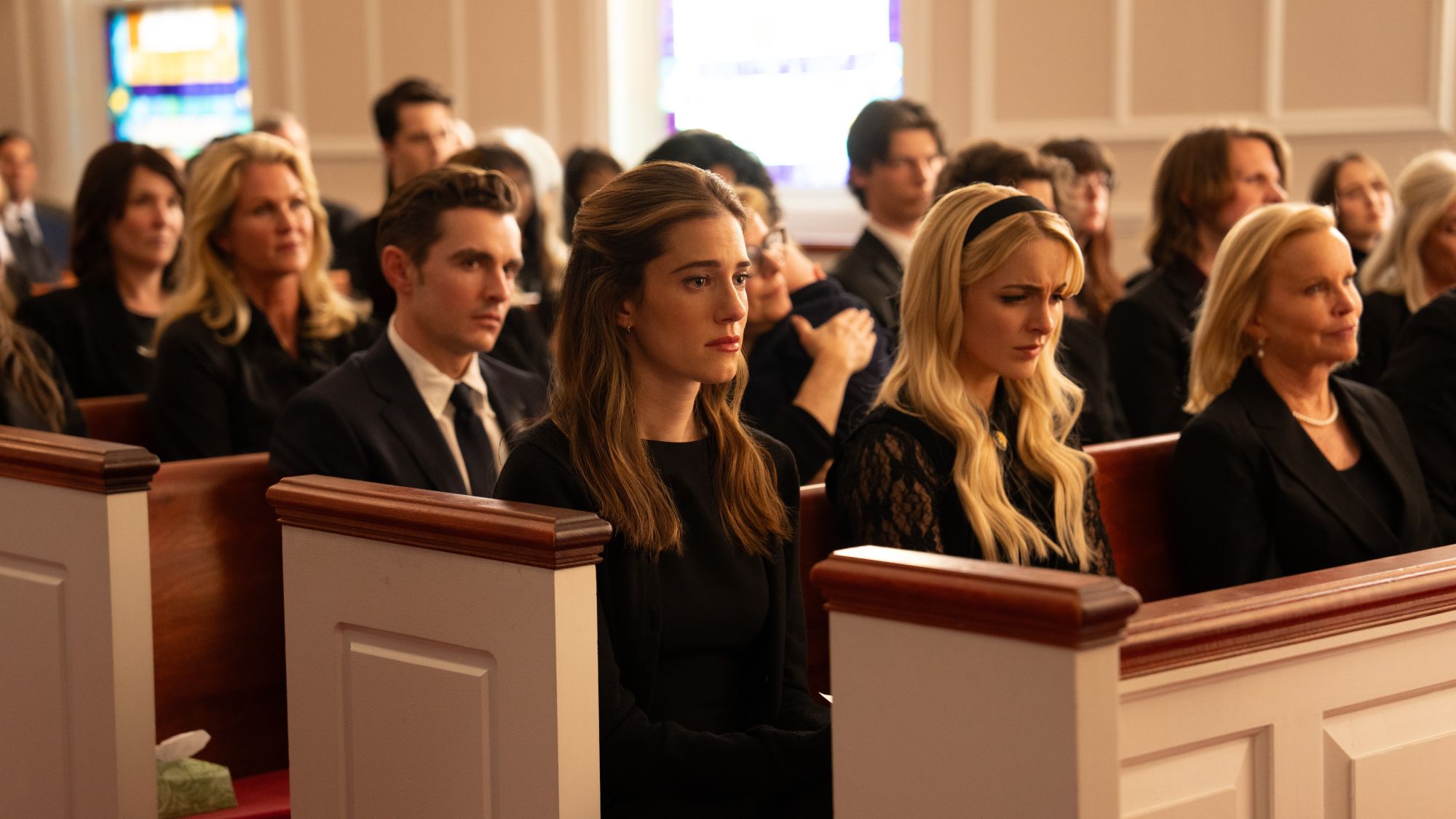Dave Franco, Allison Williams and McKenna Grace in church pews in Regretting You