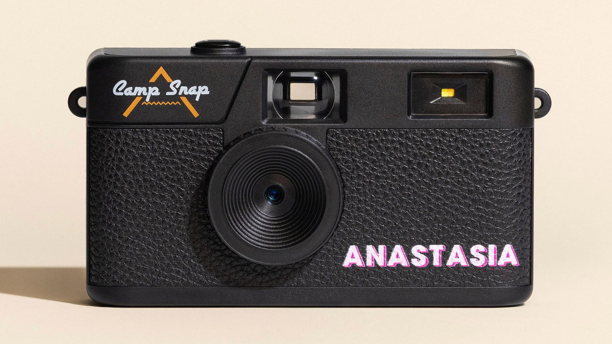 Lifestyle images of the Camp Snap Custom camera with personalized name on the front of it in block capitals