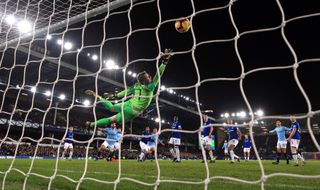 Everton keeper Jordan Pickford is beaten by a shot from Aymeric Laporte