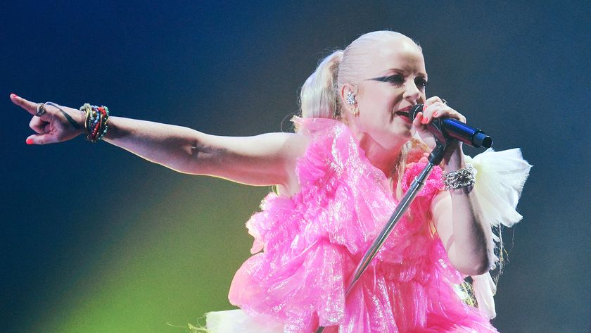 Shirley Manson on stage in a pink dress