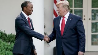 Tiger Woods and Donald Trump shake hands at the 2019 Medal of Freedom ceremony