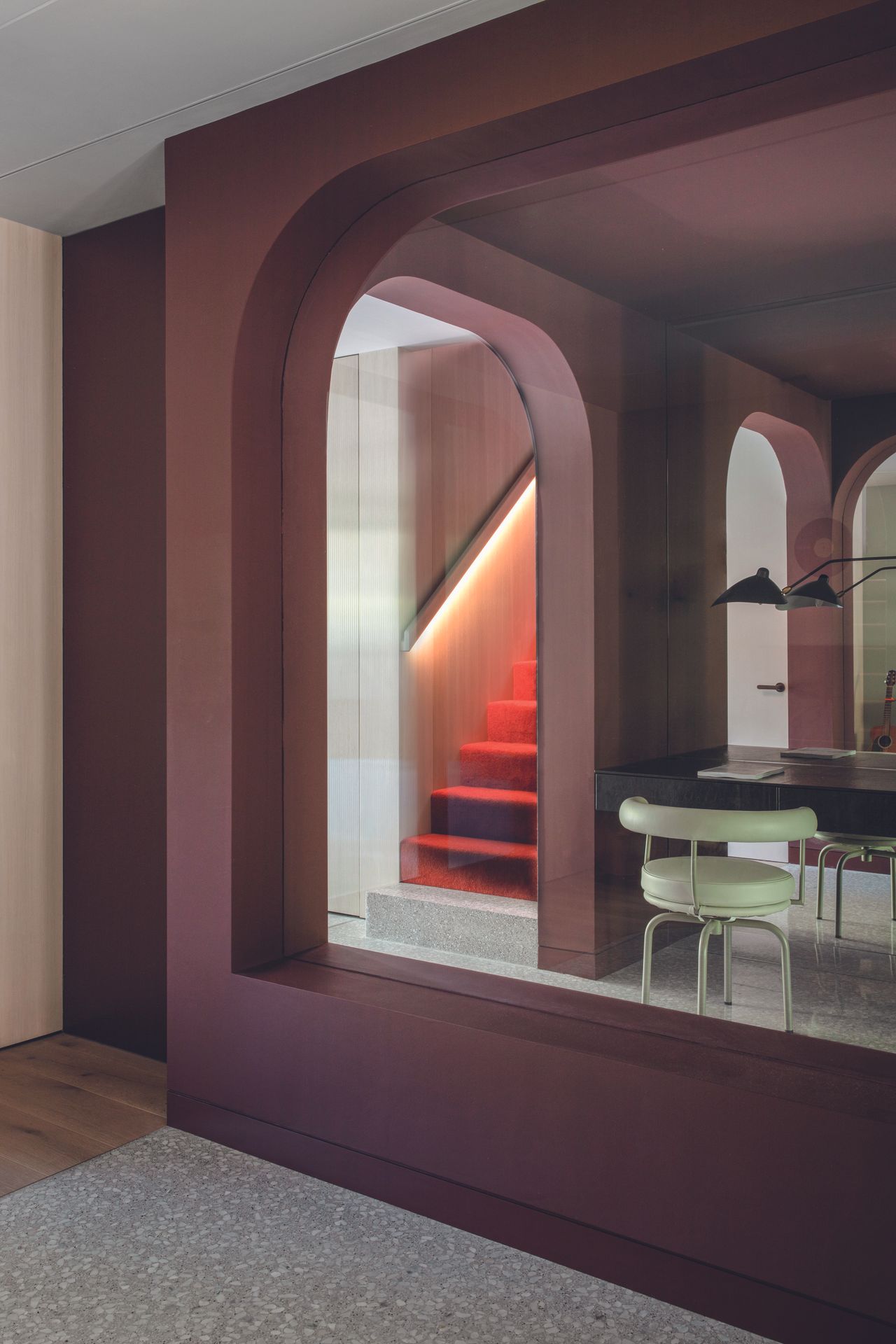 Looking through to the arched inside windows between the staircase and dining area