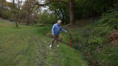 Golfer looking at red penalty area