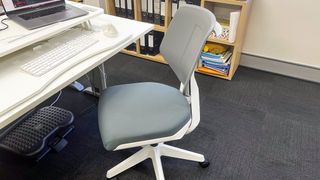Desky Swivel 3D Tilt office chair in front of a white office desk