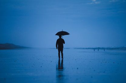 photo of person holding an umbrella