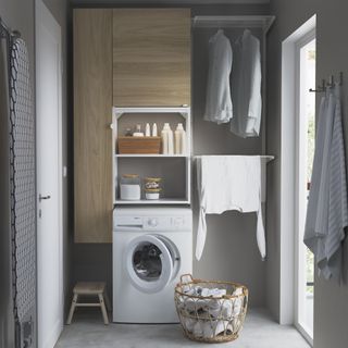 Utility room with Ikea Enhet storage unit and laundry rails