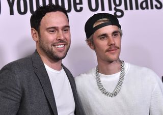 Scooter Braun and Justin Bieber at a red carpet event