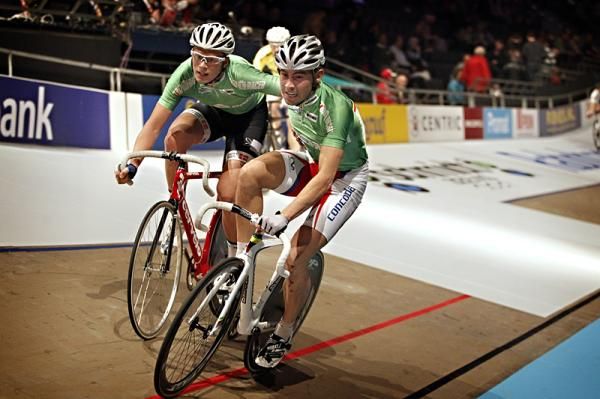 Riders exchange during the Rotterdam Six Day