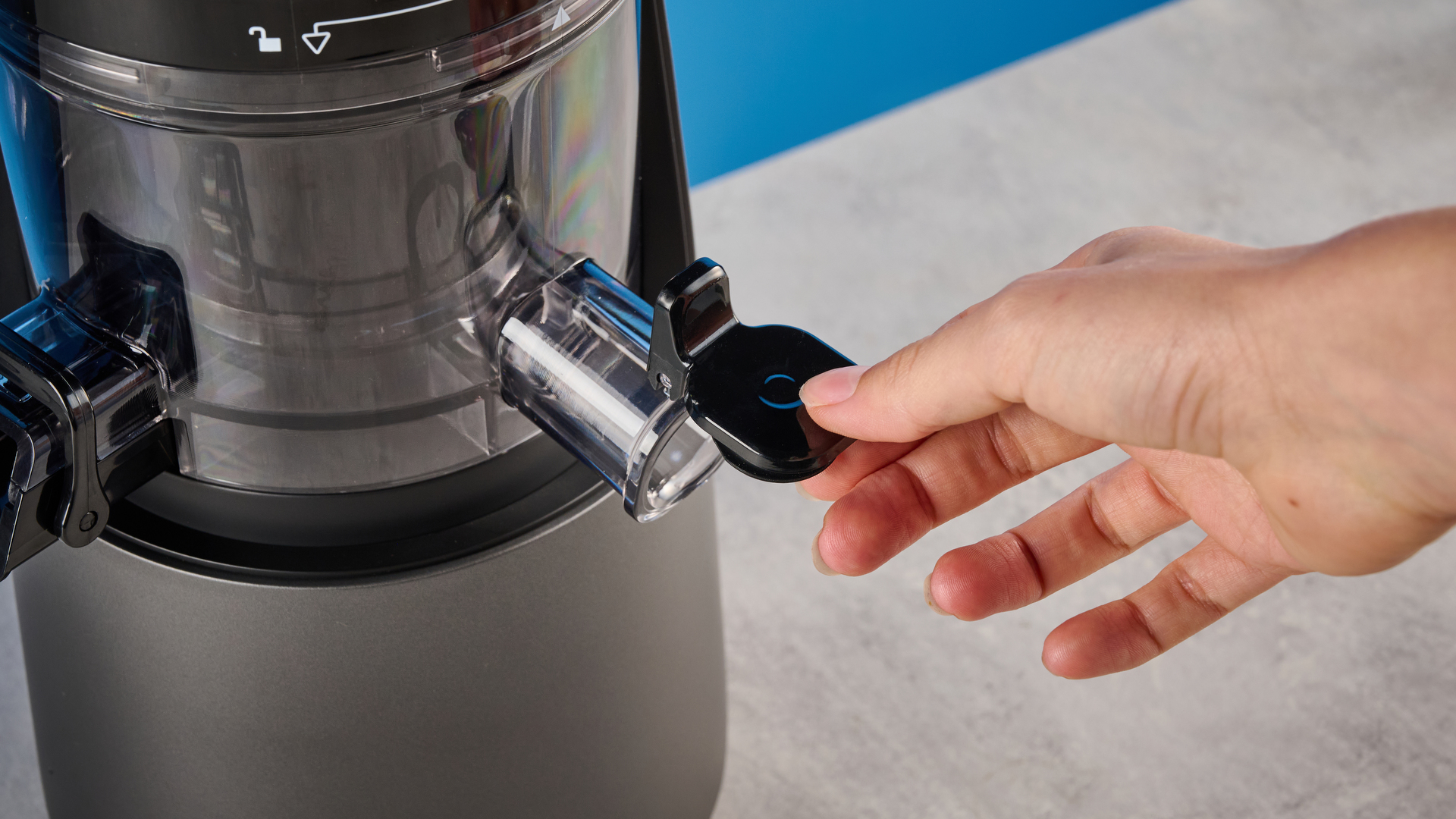 Canoly C16 Cold Press Juicer photographed in front of a blue background