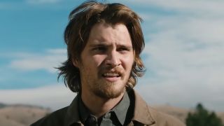 Luke Grimes as Kayce looking forward in Yellowstone. 