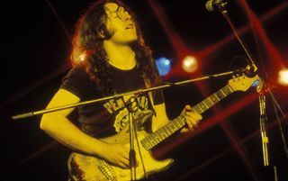 Rory Gallagher performs onstage