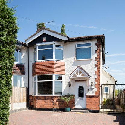 house exterior with white window and door