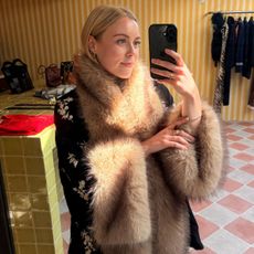 Woman wears faux fur jacket