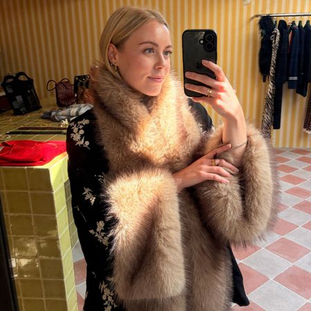 Woman wears faux fur jacket