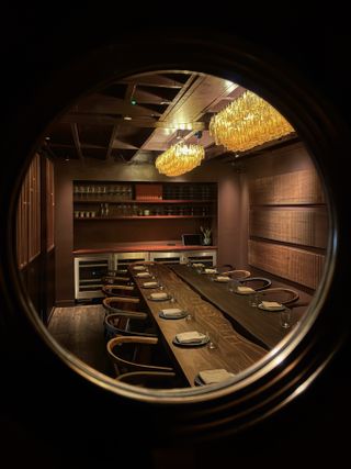 View of AngloThai restaurant interior through round window