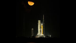 NASA's Space Launch System (SLS) moon rocket is standing tall in the moonlight after being battered by Hurricane Nicole last week ahead of its planned debut launch.