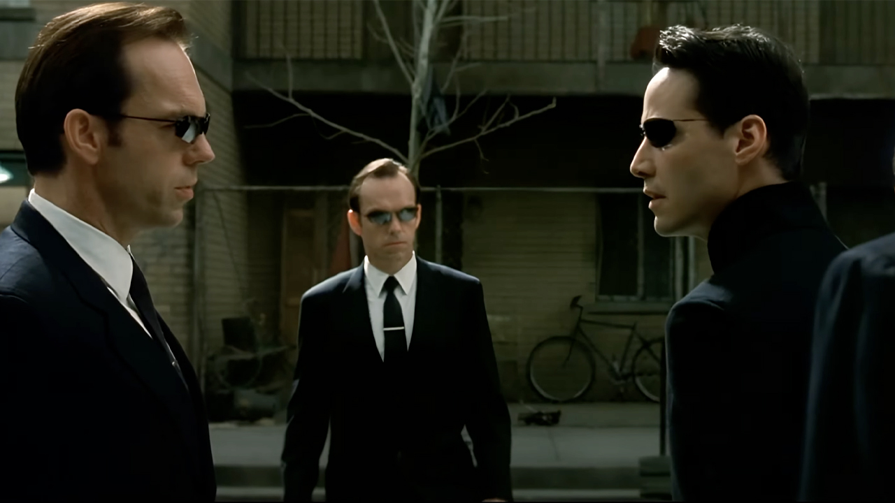 Neo facing off against Agent Smith, and an army of Agent Smiths, in The Matrix Reloaded Burly Brawl.