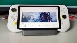 Logitech G Cloud handheld with PS App on screen sitting on dock stand