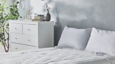 A white bedroom with double bed, chest of drawers and electric blanket by VonHaus