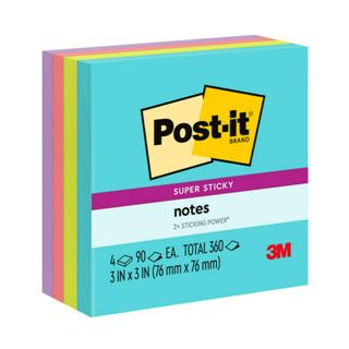 Block of Post-It notes in varying neon colors like blue, green and pink 