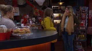 Charity Dingle and Vanessa Woodfield talk at David's Shop. Tracy Robinson is behind the counter watching them