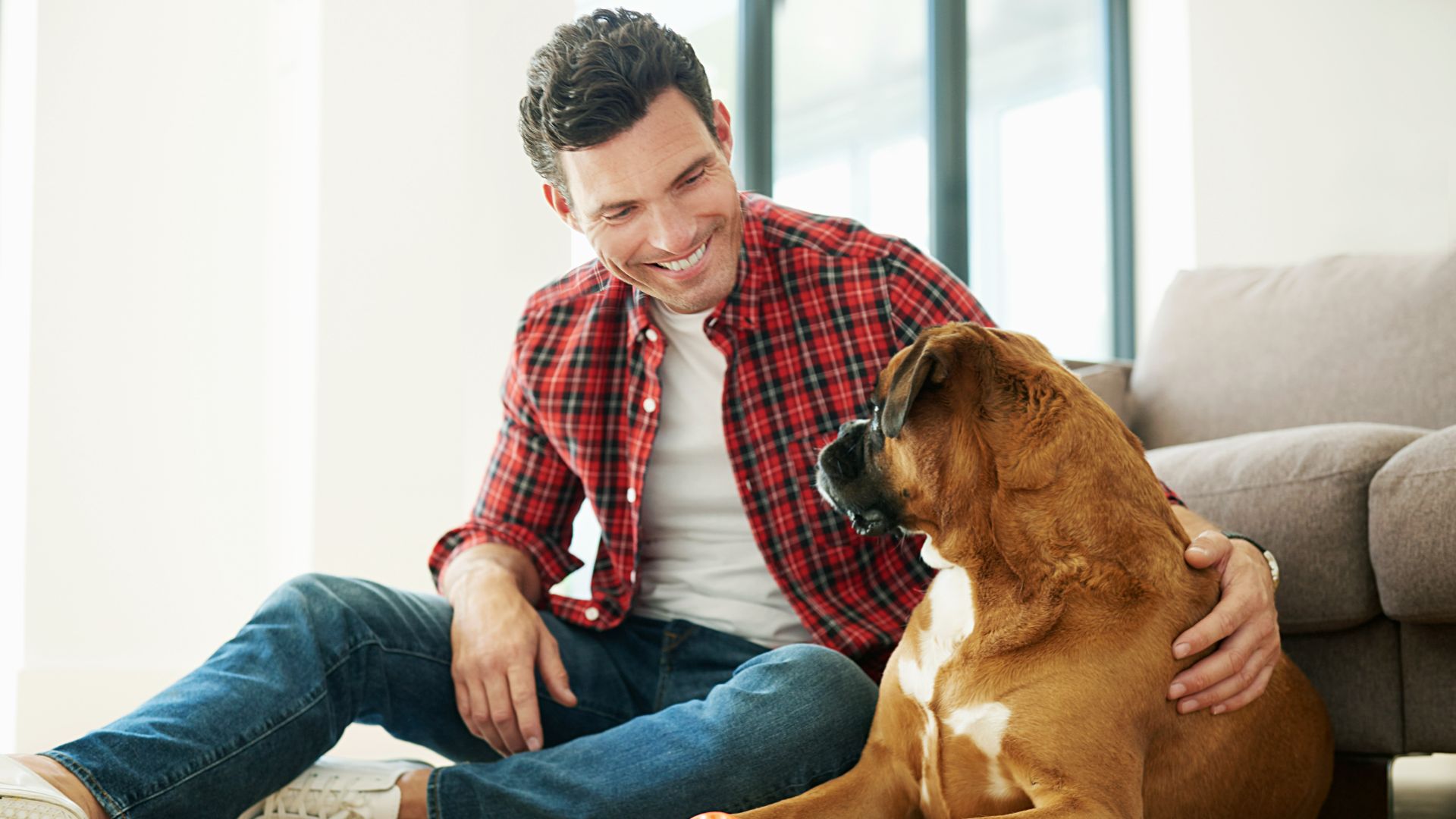 man sitting with dog