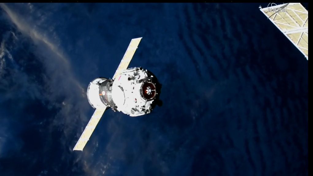 The new Russian Prichal module approaching the International Space Station.