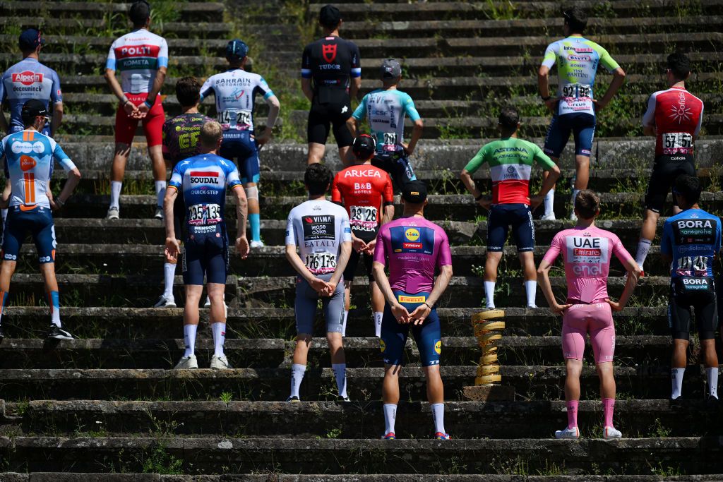 POMPEI ITALY MAY 14 LR Cian Uijtdebroeks of Belgium and Team Visma Lease a Bike White Best Young Jersey Jonathan Milan of Italy and Team Lidl Trek Purple Points Jersey Tadej Pogacar of Slovenia and UAE Team Emirates Pink Leader Jersey Daniel Martinez of Colombia and Team BORA hansgrohe Blue Mountain Jersey pose with the Trofeo Senza Fine prior to the 107th Giro dItalia 2024 Stage 10 a 142km stage from Pompei to Cusano Mutri Bocca della Selva 1389m Amphitheater of Pompei UCIWT on May 14 2024 in Pompei Italy Photo by Dario BelingheriGetty Images
