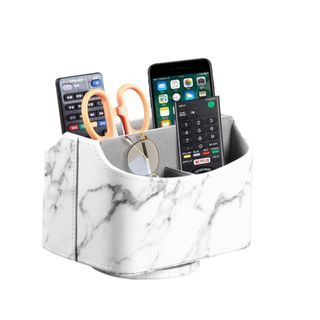 A marble desk organizer with accessories inside