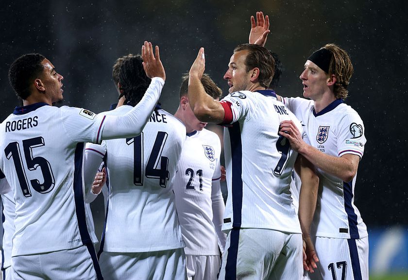 RIGA, LATVIA - OCTOBER 14: Morgan Rogers, Harry Kane and Anthony Gordon of England celebrate their team&amp;apos;s fourth goal, an own goal scored by Maksims Tonisevs of Latvia (not pictured) during the FIFA World Cup 2026 qualifier match between Latvia and England at Daugava Stadium on October 14, 2025 in Riga, Latvia. (Photo by Carl Recine/Getty Images)