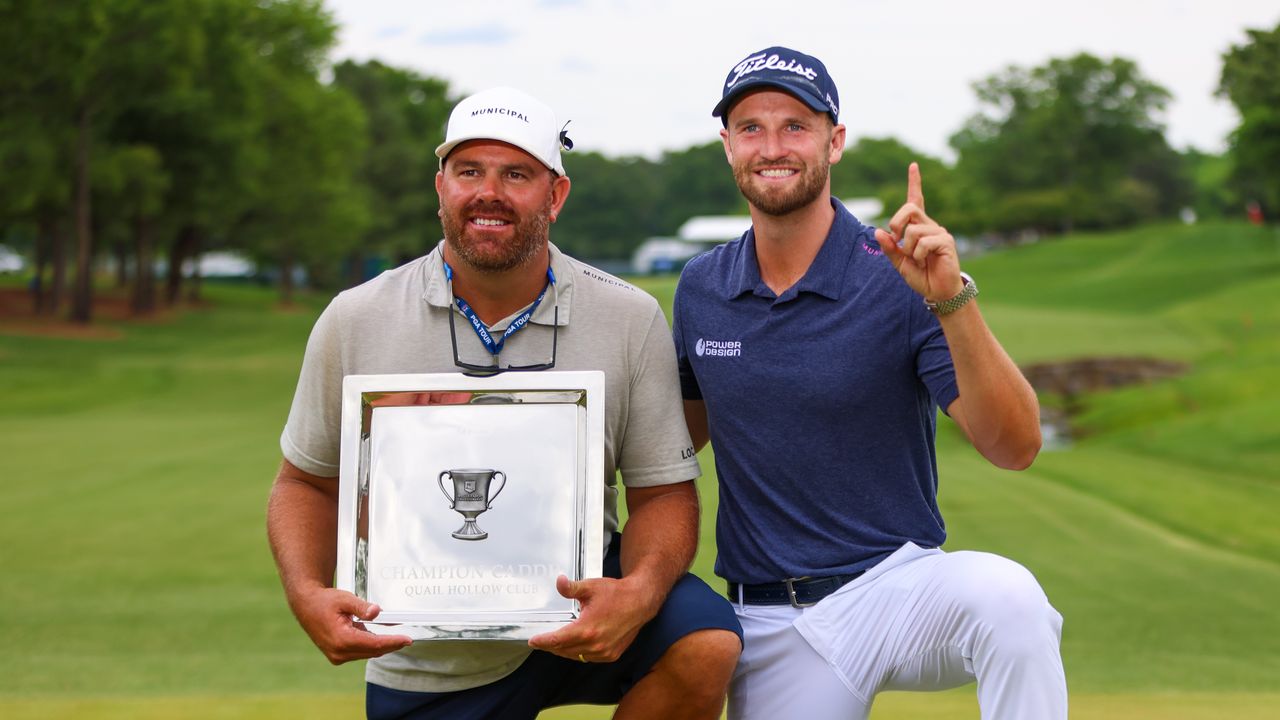 Wyndham Clark and his caddie, John Ellis pose with their winner&#039;s trophies after the 2023 Wells Fargo Championship